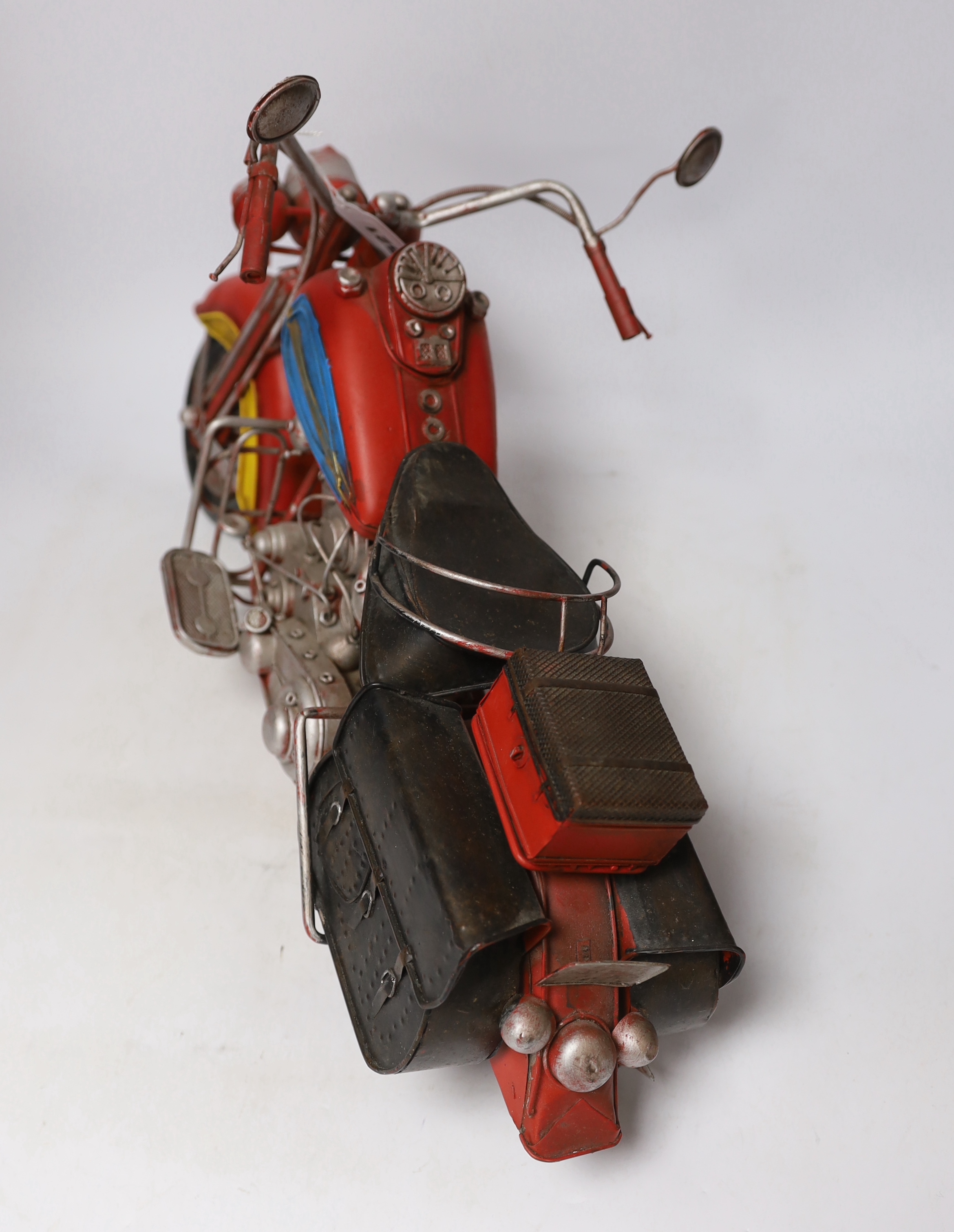 A faux tinplate motorcycle, 54cm long